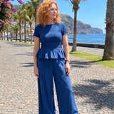 Eirenne | Krokots tops ar peplum detaļu un platu staru bikšu komplekts