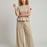 Eirenne | Krokots tops ar peplum detaļu un platu staru bikšu komplekts