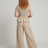 Eirenne | Krokots tops ar peplum detaļu un platu staru bikšu komplekts