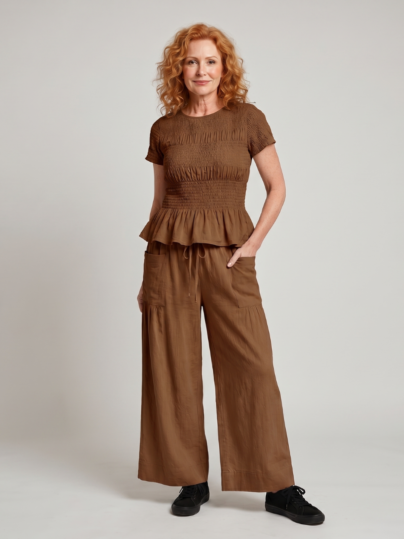 Eirenne | Krokots tops ar peplum detaļu un platu staru bikšu komplekts
