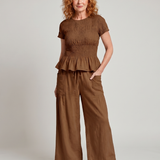 Eirenne | Krokots tops ar peplum detaļu un platu staru bikšu komplekts