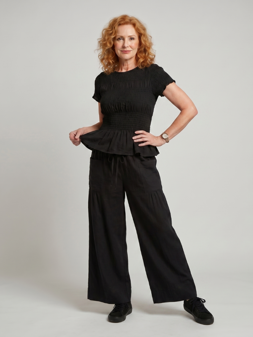 Eirenne | Krokots tops ar peplum detaļu un platu staru bikšu komplekts